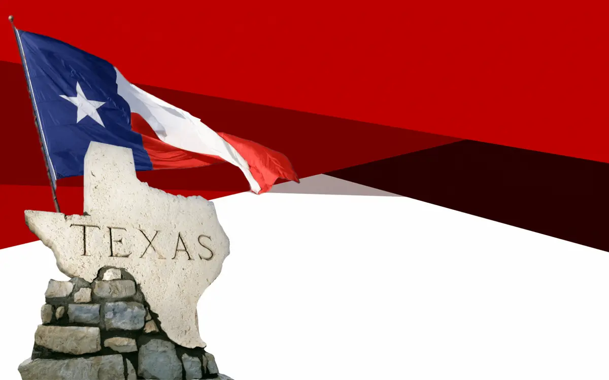 Animated Texas flag over rocky Texas hill country